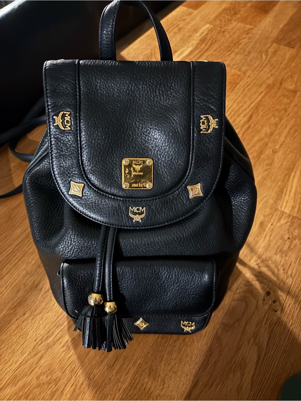 MCM Black Leather Mini Backpack with Gold Accents and Tassels